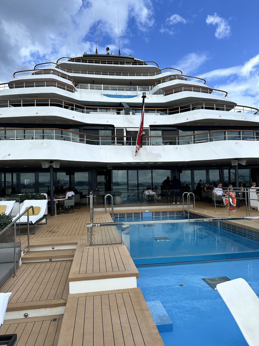 Ocean-view pool deck aboard a luxury cruise ship